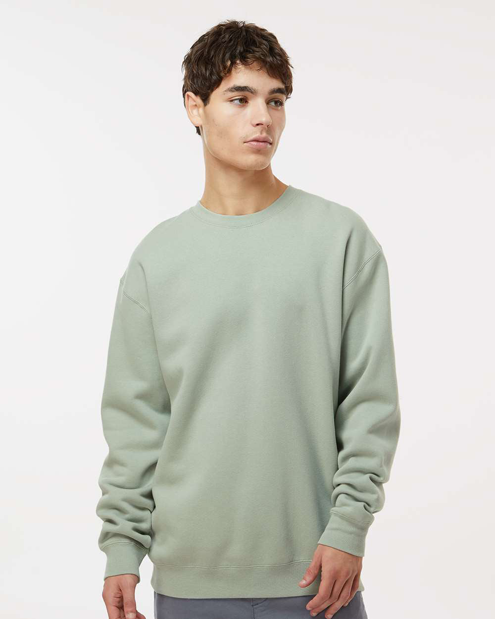 Man wearing a Dusty Sage color 10oz. Heavyweight Crew - Tiflee Tradex Company