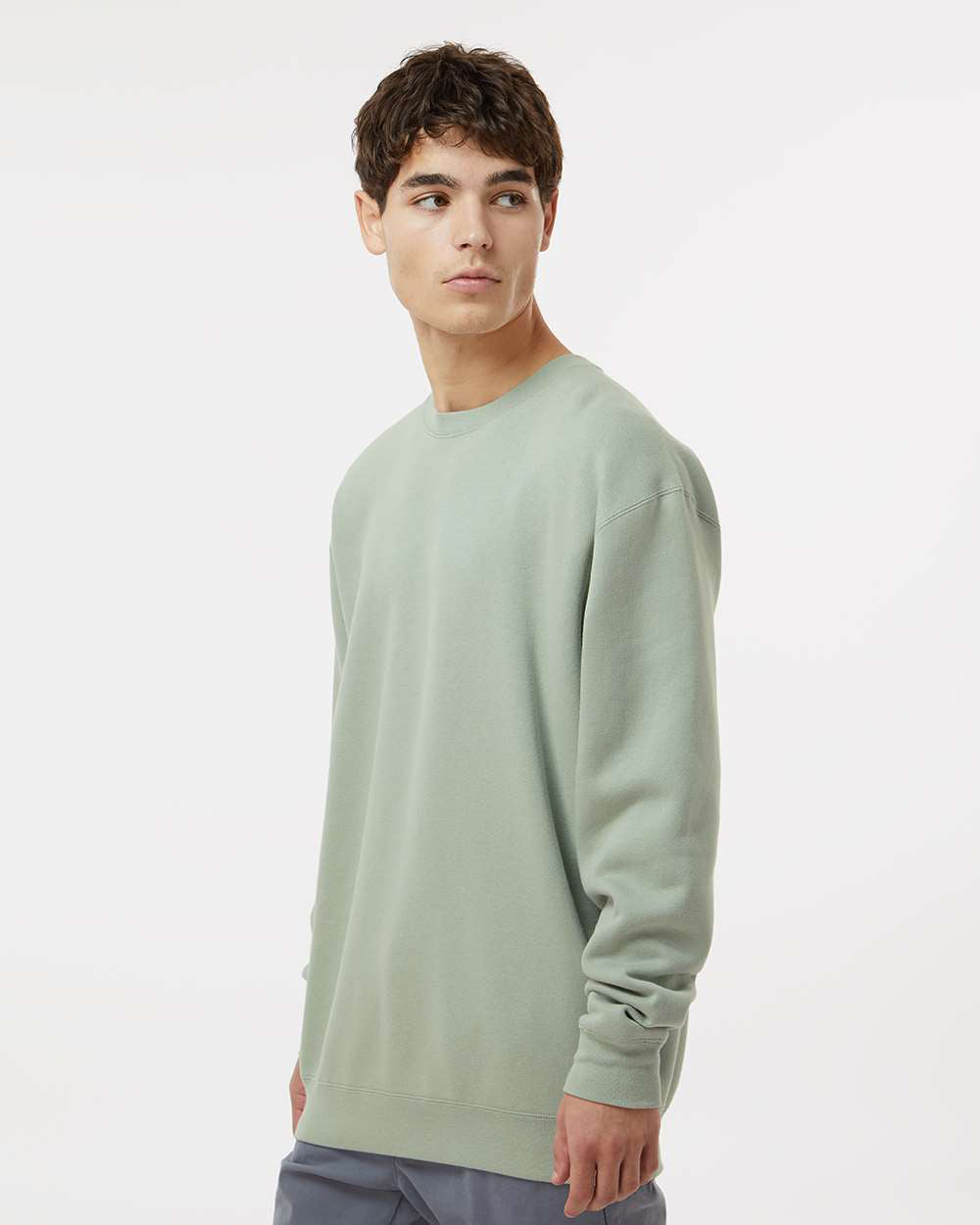 Man wearing a Dusty Sage color 10oz. Heavyweight Crew - Tiflee Tradex Company