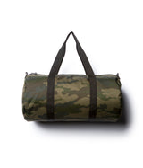 Day Tripper 29 Liter Duffle Bag made of durable polyester material with Nylon handles and removable shoulder strap in Forest Camo
