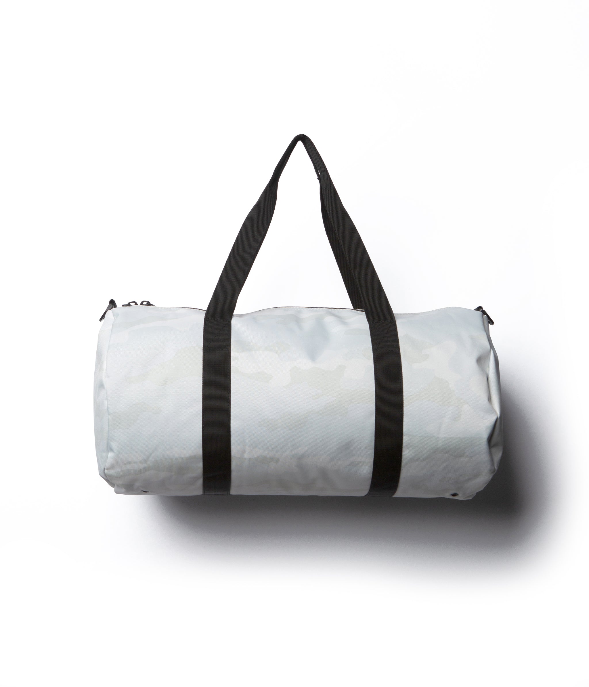 Day Tripper 29 Liter Duffle Bag made of durable polyester material with Nylon handles and removable shoulder strap in White Camo